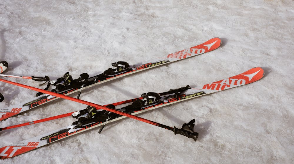 Pair of skis on snowy surface in winter setting
